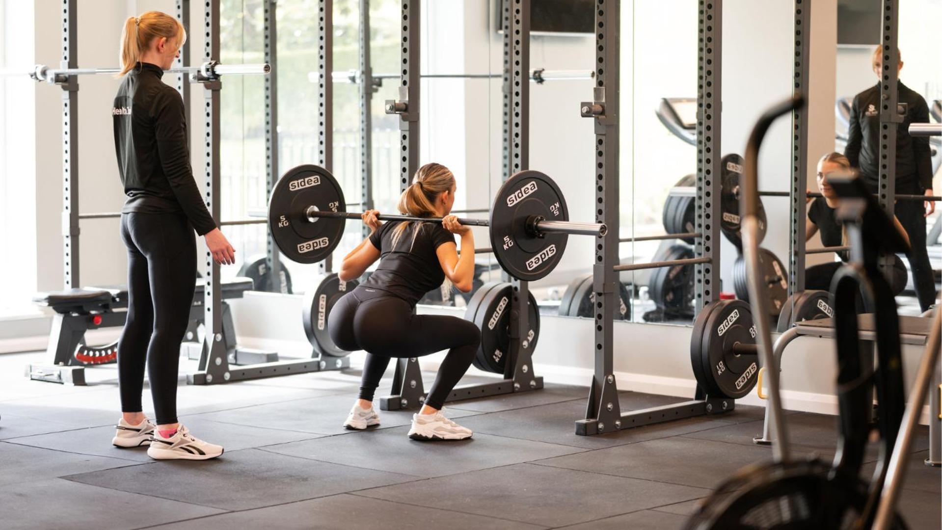 The Culloden Estate And Spa Holywood  Exterior foto A woman performing a back squat with a barbell